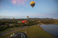 Balloons over vineyards in Pokolbin wine region at sunrise, Hunter Valley, NSW, Australia