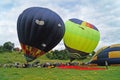 Balloons of red, blue, yellow, light green and orange inflate Royalty Free Stock Photo