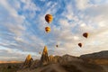 Balloons rising in sunrise in Cappadocia Turkey