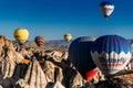 Balloons in the sky over Turkey at sunrise. Colorful balloons move in the blue sky over Goreme. Cappadocia Balloon Festival.