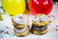 Balloons with streamers and donuts