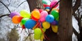 Balloons tangled in a tree, illustrating the pervasiveness of pollution, concept of Environmental degradation, created Royalty Free Stock Photo