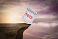 Ballot box on the edge of the cliff demonstrating Election risk. 3D illustration. Royalty Free Stock Photo