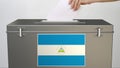 Ballot box with flag of Nicaragua, election related 3d rendering