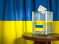 Ballot box with flag of Ukraine and voting papers. Ukrainian presidential or parliamentary election Royalty Free Stock Photo