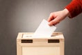 Ballot box with person casting vote Royalty Free Stock Photo