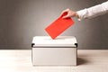 Ballot box with person casting vote Royalty Free Stock Photo