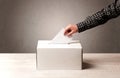 Ballot box with person casting vote Royalty Free Stock Photo