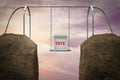 Ballot box on a swing between two mountains demonstrating Election risk. 3D illustration. Royalty Free Stock Photo