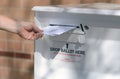 Ballot drop off of husband and wife's ballot Royalty Free Stock Photo