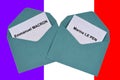 Ballot papers for Emmanuel Macron and Marine Le Pen on a background of the French flag
