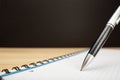 Ballpen and notebook close up Royalty Free Stock Photo