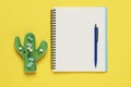 Ballpoint pen, notebook and different clips on yellow background, flat lay Royalty Free Stock Photo