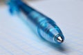 Ballpoint pen on open spiral notebook, macro Royalty Free Stock Photo