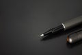 Ballpoint pen and pens cap on dark background with luxury style Royalty Free Stock Photo