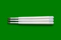 Ballpoint pen refills. Plastic refills for ballpoint pens. White ink refills on a green Royalty Free Stock Photo