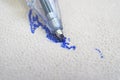 Ballpoint pen tip, scribbling on a white leather sofa Royalty Free Stock Photo