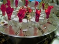 Ballroom table setting with spandex table cover, red centerpiece and red napkins