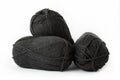 Balls of black plain yarn on white background. Royalty Free Stock Photo