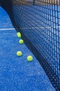 balls on a blue paddle tennis court with artificial grass Royalty Free Stock Photo