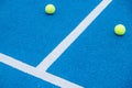 balls on a blue paddle tennis court with artificial grass Royalty Free Stock Photo