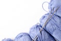 Balls of blue yarn and knitting needles. White background. Copy space. The concept of women`s needlework Royalty Free Stock Photo