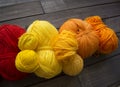 Balls of colored yarn.The process of knitting caps.