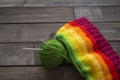 Balls of colored yarn.The process of knitting caps.