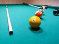 Balls and cue on the billiard table. Royalty Free Stock Photo