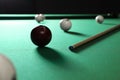 Balls and cue on billiard table Royalty Free Stock Photo