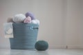 Balls of different colored threads for knitting in cotton pastel navy basket Royalty Free Stock Photo