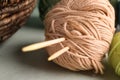 Balls of knitting yarn with needles on table, closeup Royalty Free Stock Photo