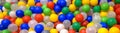 Balls in playground for colorful background. Top panoramic view of dry plastic pool