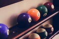 Balls for pool billiards on the shelf colored or white balls for billiards on a wooden background. Royalty Free Stock Photo