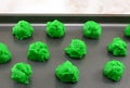 Raw green Saint Patrick`s Day cookie batter on baking sheet