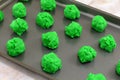 Raw green Saint Patrick`s Day cookie batter on baking sheet