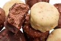 Balls of vanilla and chocolate ice cream isolated on white background, close up