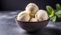 Balls of vanilla ice-cream in ceramic bowl. Delicious summer dessert