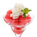 Balls of watermelon in a glass Cremant with whipped cream. Isolated on white. Royalty Free Stock Photo