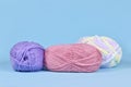 Balls of wool on blue background Royalty Free Stock Photo