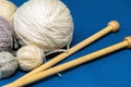 Balls of wool yarn for knitting on a blue background
