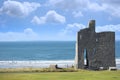 Ballybunion castle ruins with surfers Royalty Free Stock Photo