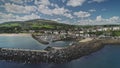 Ballycastle port cityscape aerial timelapse, hyperlapse view: houses, ships, yachts, boats at ocean