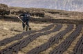 Marking the turf on an Irish bog.