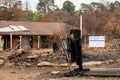 Australian bushfire aftermath: Burnt and damaged property with Hazard Identification Notice