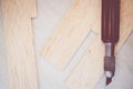 balsa wood sheet and cutting knife Royalty Free Stock Photo
