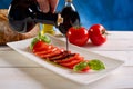 Balsamic vinegar over tomatoes