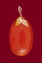 Baltic amber closeup on red background Royalty Free Stock Photo