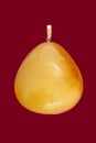 Baltic amber closeup on red background Royalty Free Stock Photo