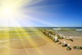 Baltic coast, the sun and the breakwater